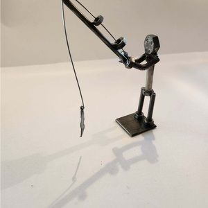 Metal at art man fishing  4x6x2  weighs 1lb